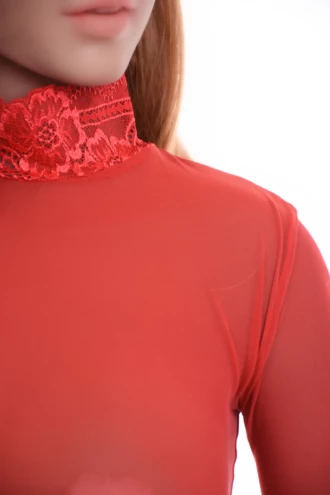 All-over lace-and-mesh bodysuit by Tiara Galiano with thong back, a statement under an open blazer.