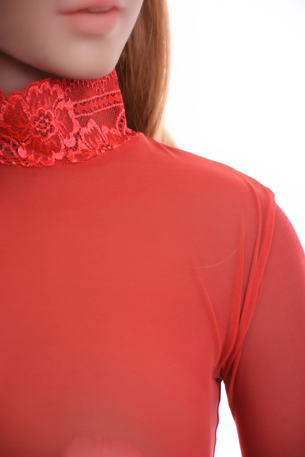 All-over lace-and-mesh bodysuit by Tiara Galiano with thong back, a statement under an open blazer.