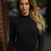 Black wool base-layer bodysuit with high neck and long sleeves for extra warmth at the throat and arms.