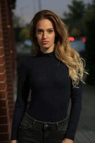 Black wool base-layer bodysuit with high neck and long sleeves for extra warmth at the throat and arms.
