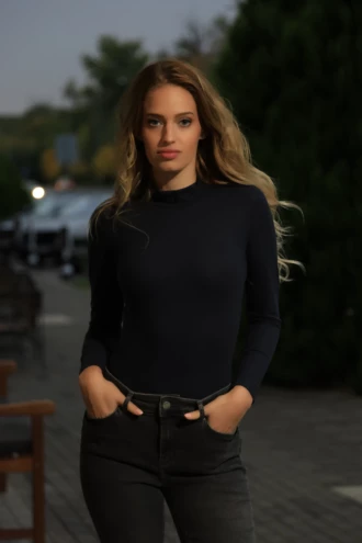 Black wool-blend bodysuit by Tiara Galiano with mock neck and long sleeves, a warm lightweight winter base.
