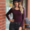 Breathable cotton bodysuit by Tiara Galiano with hook-and-eye closure and a clean thong line.