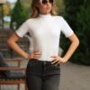 Cotton bodysuit with mock neck and short sleeves, breathable and soft for everyday wear.