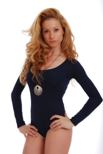 Breathable cotton shirt bodysuit with scoop neck, sitting close without restricting movement.