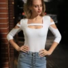Cotton shirt bodysuit by Tiara Galiano with scoop neck, a core essential that stands alone with denim.