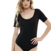 Cotton tee bodysuit with scoop neck and bikini coverage, tucked clean with a hook-and-eye gusset.
