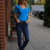 Cotton-blend tee bodysuit with thong back, breathable and close without clinging under clothing.