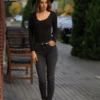 Warm knitted wool-blend bodysuit with bikini coverage and long sleeves, a lightweight winter base.