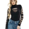 Long-sleeve cotton bodysuit by Tiara Galiano, covered at the neck and arms, smooth under knitwear or a blazer.
