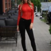 Long-sleeve mesh bodysuit by Tiara Galiano with mock neck and hook-and-eye fastening, easy to layer.