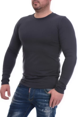 Breathable cotton men's long-sleeve crew-neck tee worn smoothly as a base layer under knits.