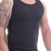 Breathable cotton men's tank top worn as a base layer under shirts for added comfort.