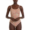 Sleeveless mesh bodysuit in an all-over paisley print with contrast cream binding at the neckline and legs.