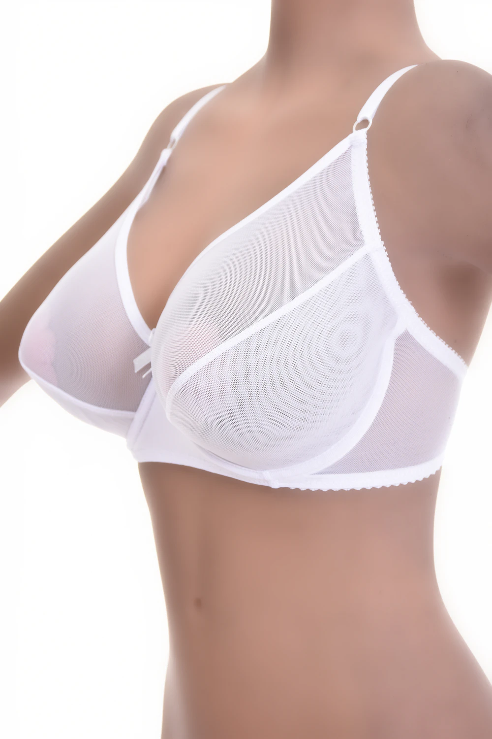 Sheer mesh soft-cup bra with unpadded cups and a plain neckline, light and see-through with a natural shape.