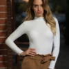 Mock-neck cotton bodysuit by Tiara Galiano, a year-round layering base under knitwear or a slip dress.