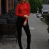 Mock-neck lace bodysuit in bold red over a thong cut, all-over lace for a clean covered line.