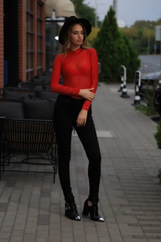 Mock-neck lace bodysuit in bold red over a thong cut, all-over lace for a clean covered line.