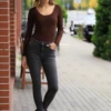 Scoop-neck long-sleeve cotton bodysuit with thong bottom and a relaxed everyday line.