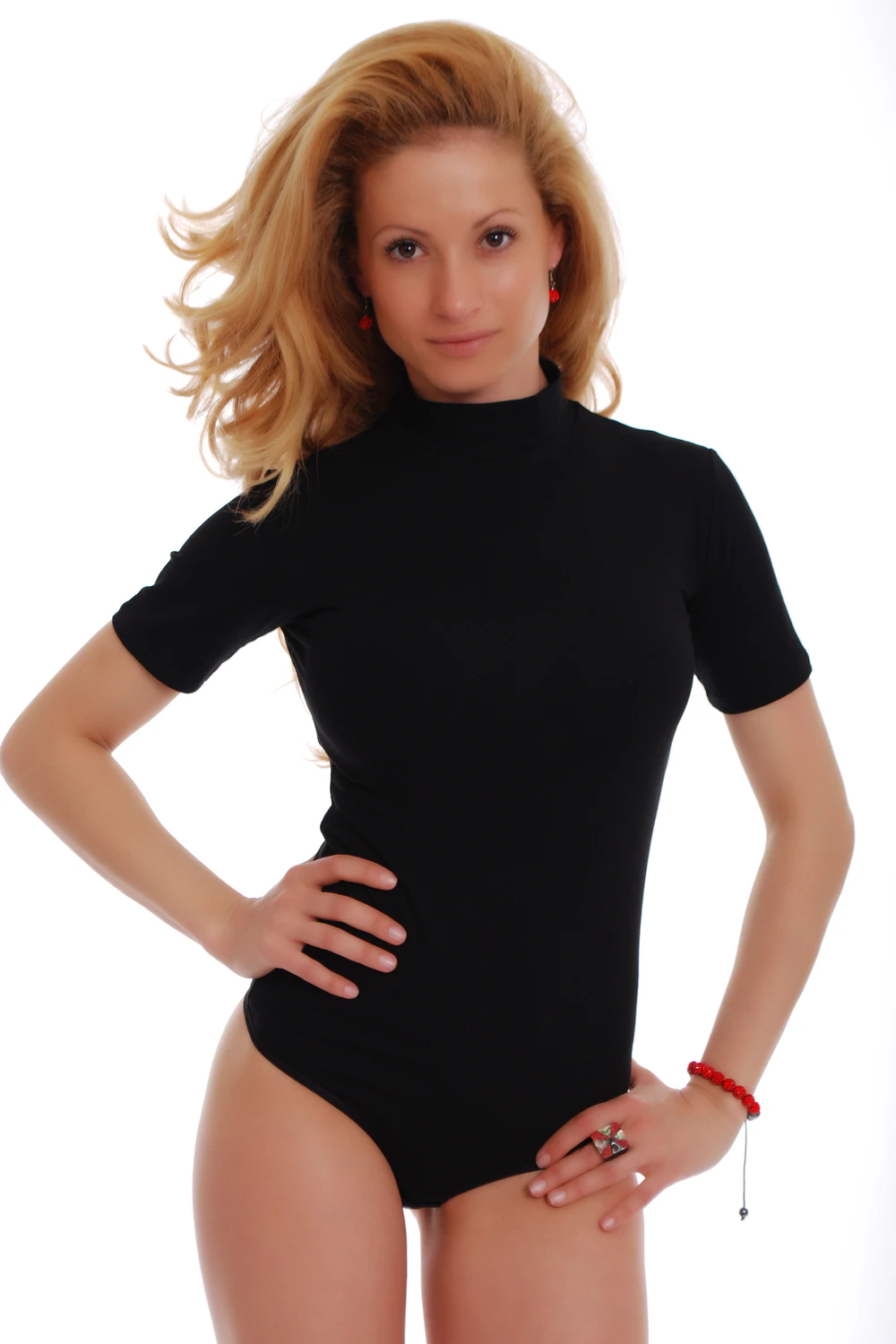 Short-sleeve cotton bodysuit by Tiara Galiano with mock neck, an easy transitional layer under a blazer.