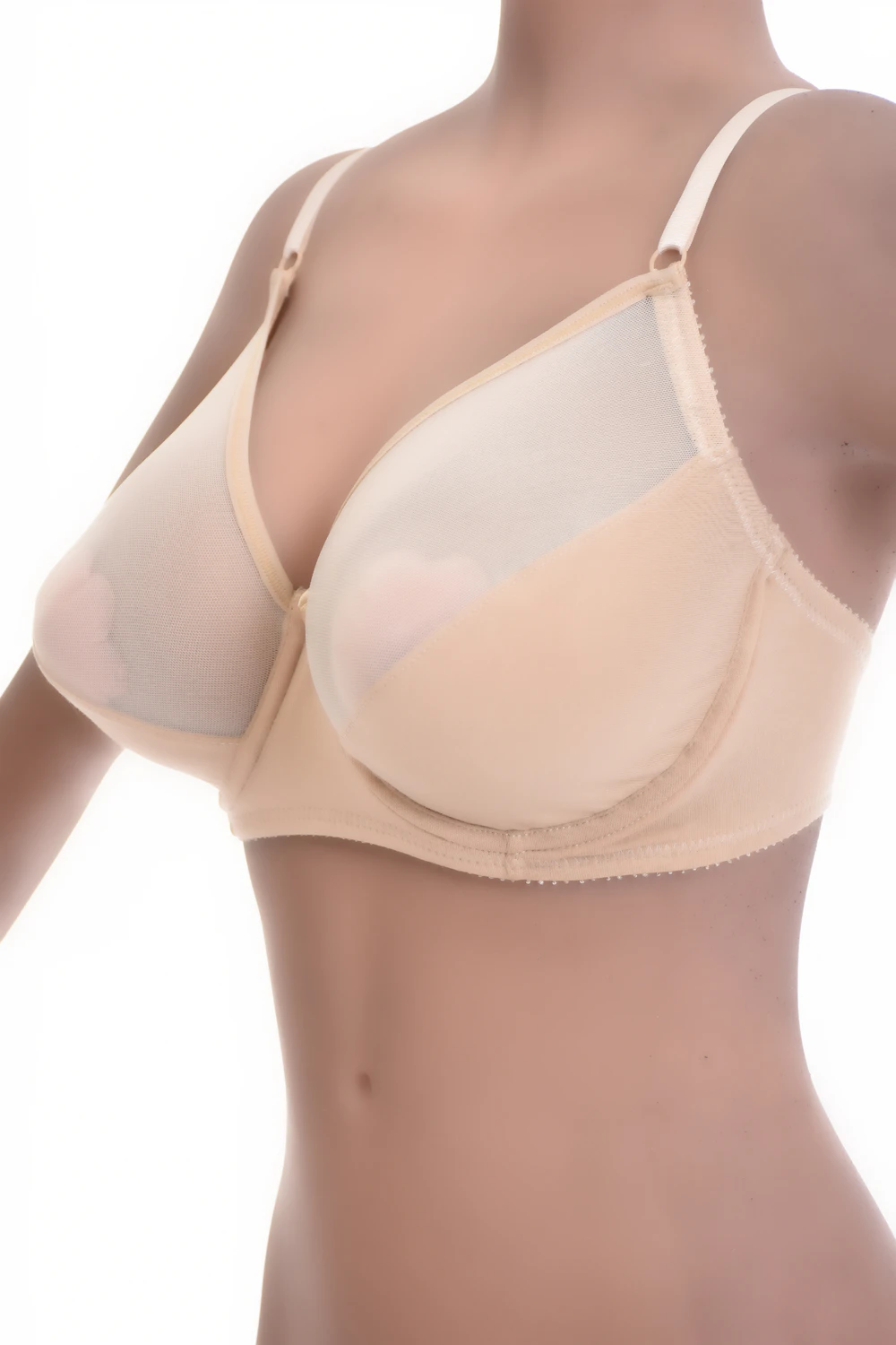 Smooth unpadded soft-cup bra with a see-through mesh detail at the edges and fine adjustable straps.