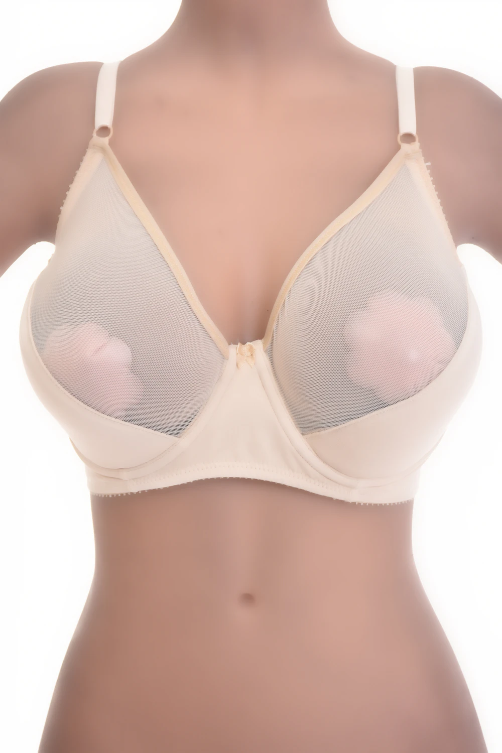 Smooth unpadded soft-cup bra with see-through mesh panels and fine adjustable straps, light for everyday wear.