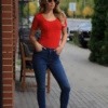 Tiara Galiano cotton tee bodysuit with scoop neck, tucked clean by a hook-and-eye gusset.