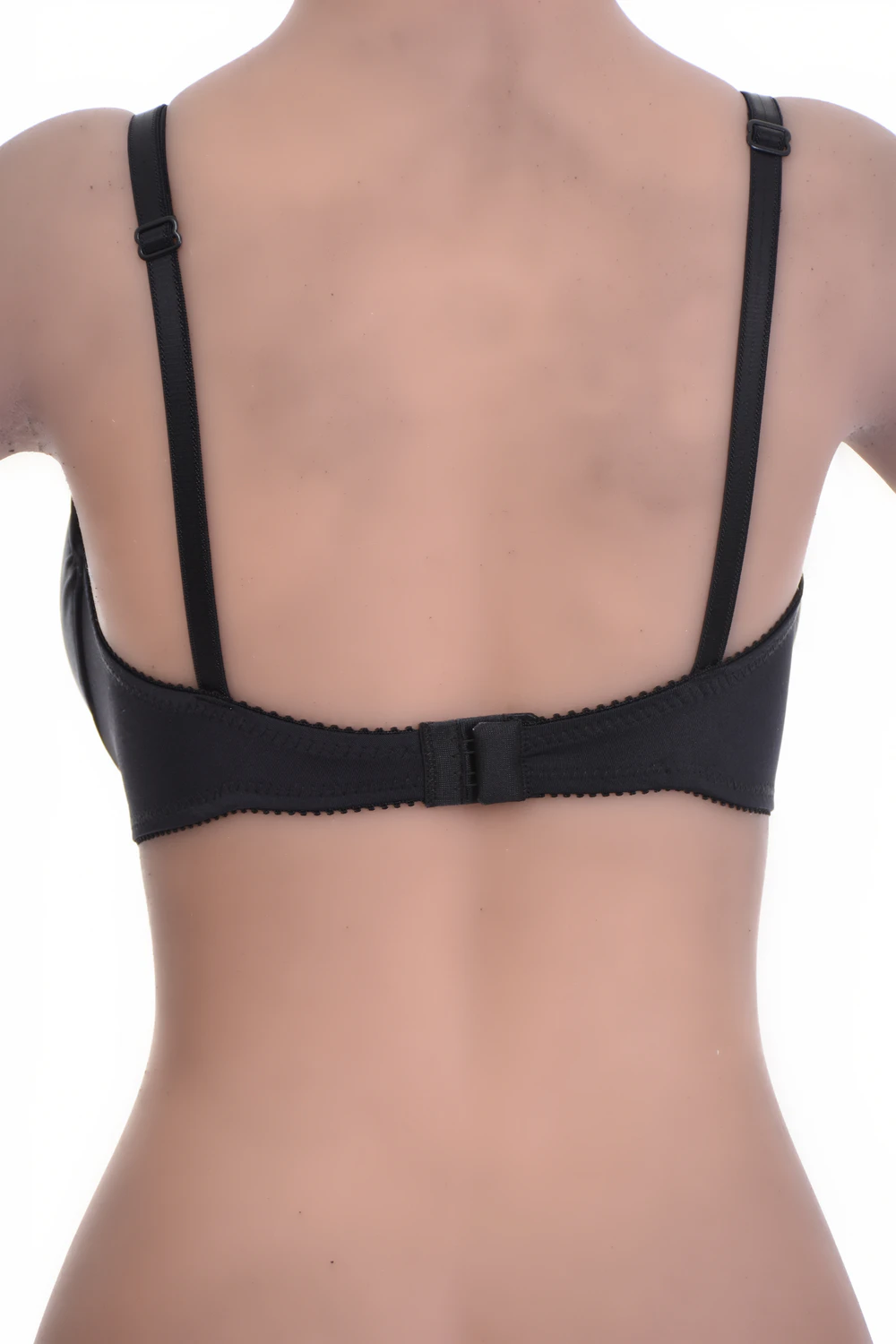 Unpadded microfiber bra with sheer mesh panels and a smooth finish, sitting flat under fitted tops all day.