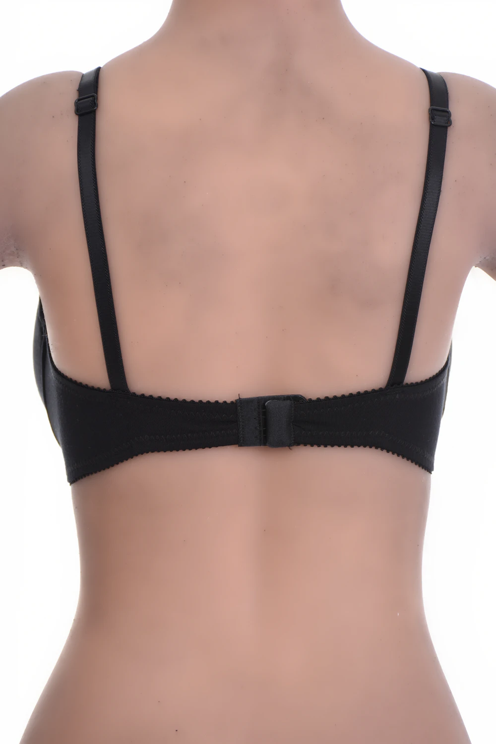 Unpadded microfiber soft-cup bra with sheer mesh trim, smooth under fitted tops with a back hook-and-eye closure.
