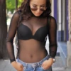 Women's black mesh bodysuit with mock neck, long sleeves and brazilian cut, a fine close everyday layer.