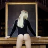 Women's cotton shirt bodysuit with scoop neck and long sleeves, a relaxed layer over a thong bottom.