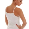 Women's cotton camisole with thin spaghetti straps and a scoop neck, soft and slim for layering under a shirt.