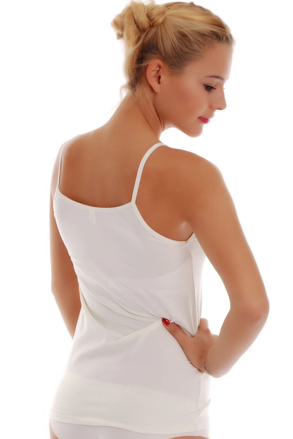 Women's cotton camisole with thin spaghetti straps and a scoop neck, soft and slim for layering under a shirt.