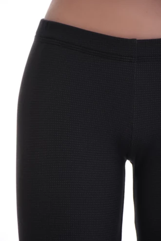 Close-up of anthracite microfiber leggings showing the fine horizontal ribbed texture of the fabric