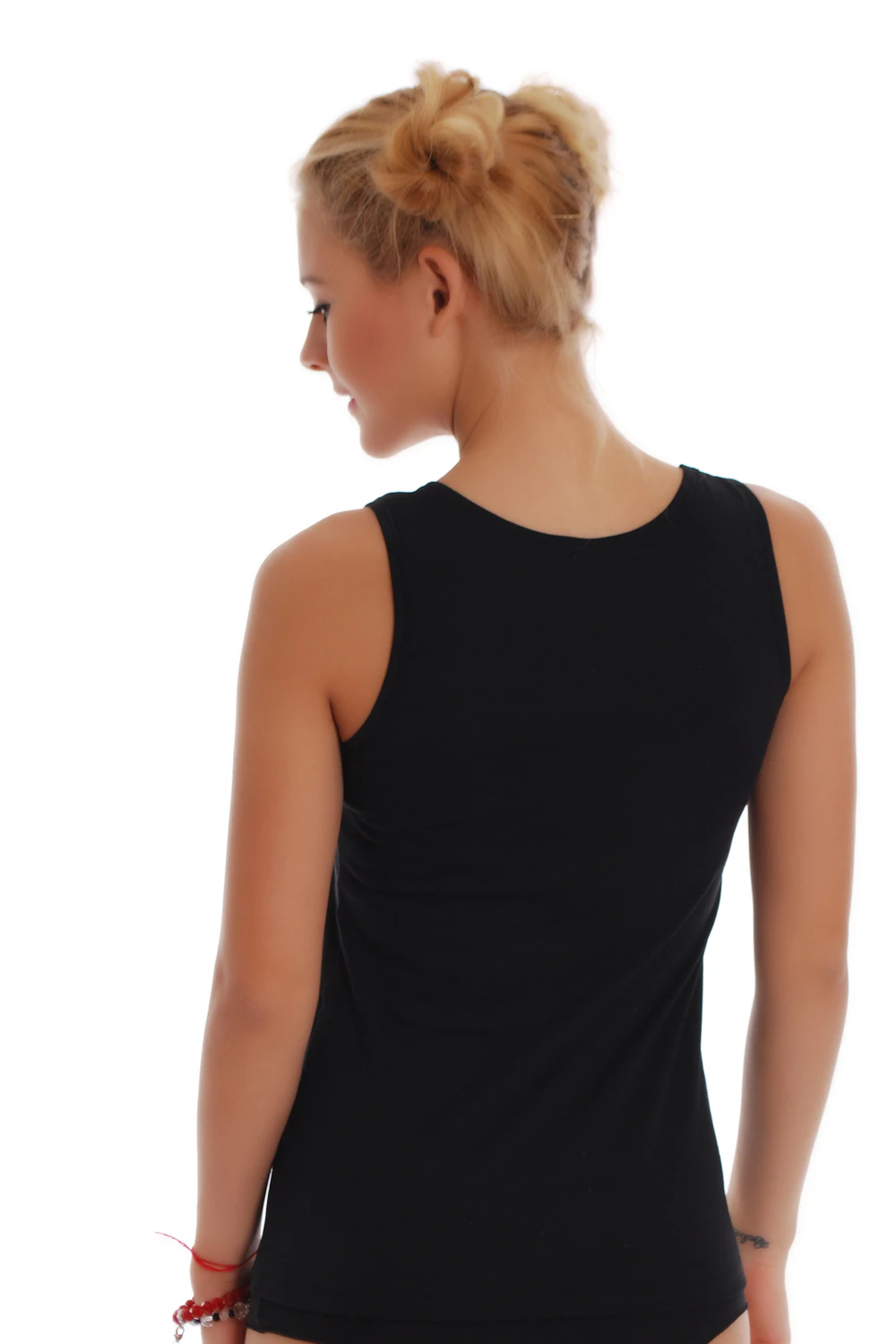 Slim soft cotton tank with a low scoop and wide straps, breathable against the skin with an easy pull-on shape.