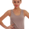 Soft cotton-blend tank with a low scoop and wide flat straps, slim and close to wear under a shirt or alone.