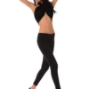 Black women's wool leggings on a model, full-length front view in a warm soft knitted wool blend