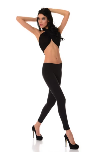 Black women's wool leggings on a model, full-length front view in a warm soft knitted wool blend
