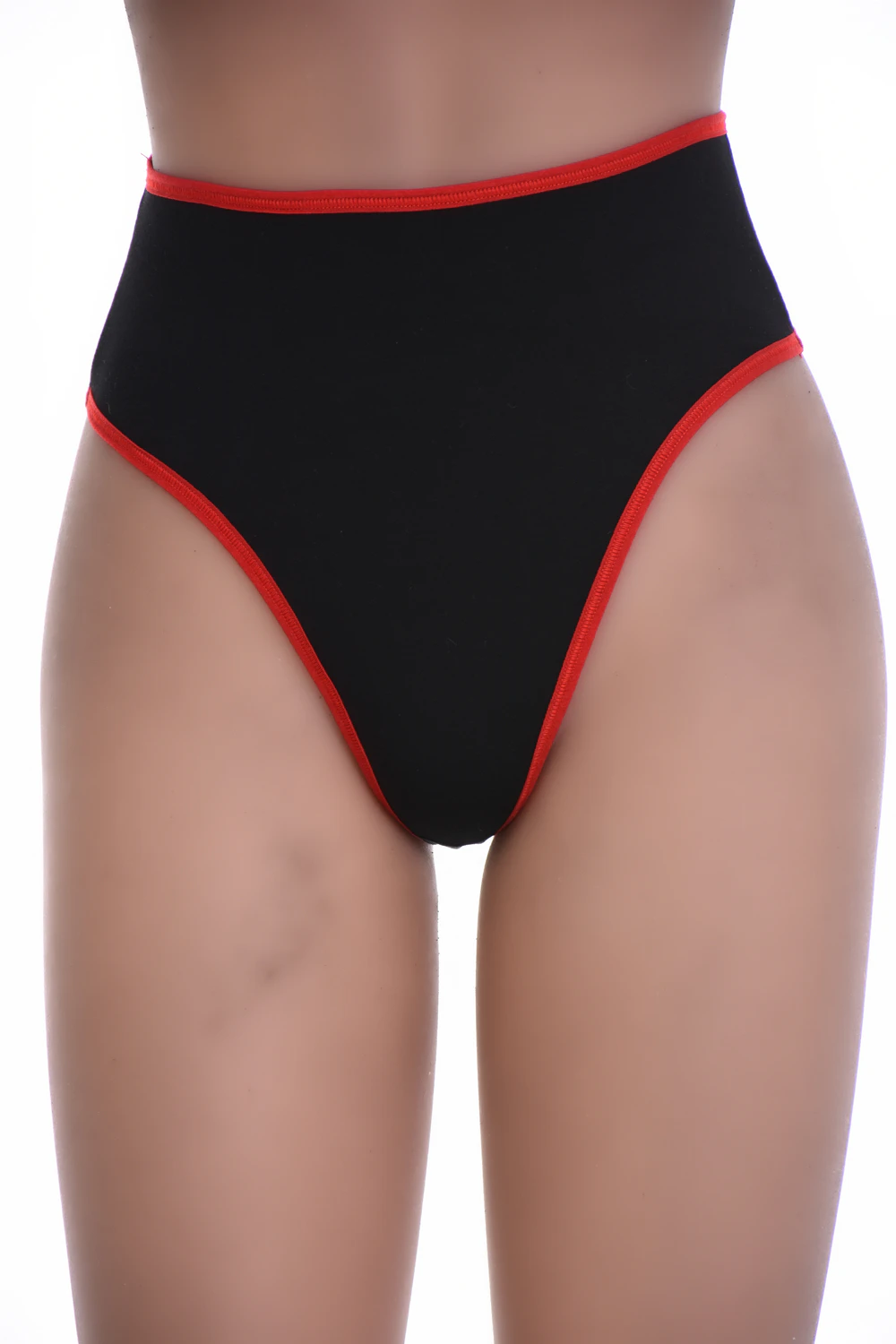 Black high-waisted cotton thong with light tummy coverage and a thong back, a smooth breathable staple.