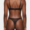 Black lace bra and thong set with molded cups, a scalloped neckline and matching floral-lace thong.