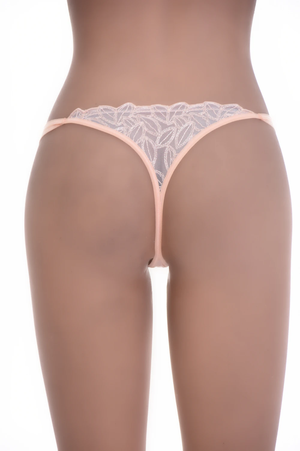 Soft pink lace thong with strappy sides and a floral front, a light pretty everyday cut.