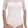 Champagne cotton bodysuit with lace trim, a mock neck, short sleeves and thong cut for a clean line.