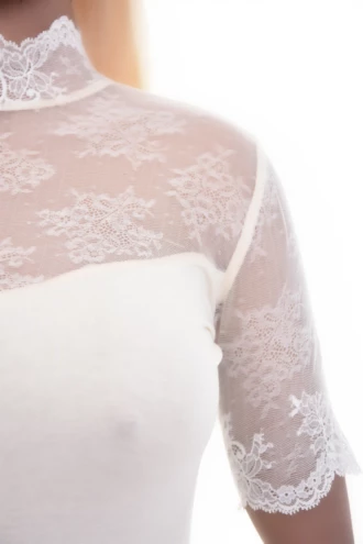 Soft cotton-blend bodysuit in a polo cut with mock neck, finished with decorative lace trim.