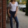Soft fitted cotton T-shirt bodysuit with scoop neck, a plain tee that stays exactly where you put it.