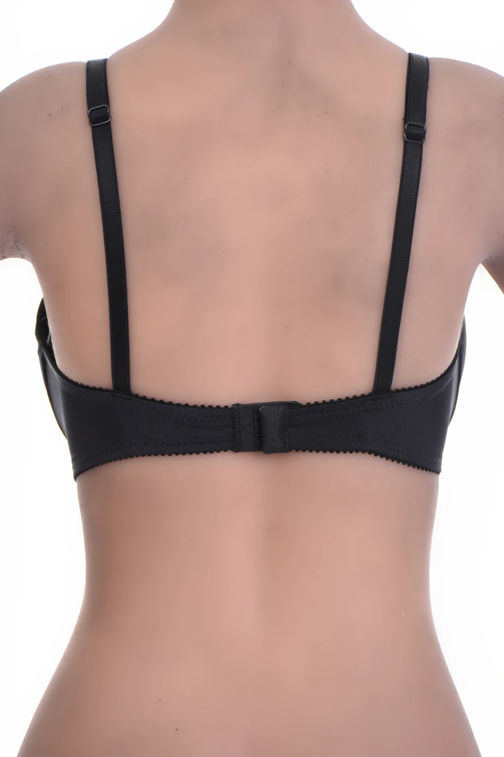 Soft unpadded lace bra with a small center bow and a microfiber band that keeps the base smooth and steady.