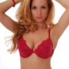 Floral-lace bra with molded cups and a microfiber band, finished with a scalloped neckline and hook-and-eye back.