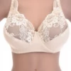 Lace soft-cup bra with a center bow and microfiber lower cup, unpadded for a natural everyday shape.