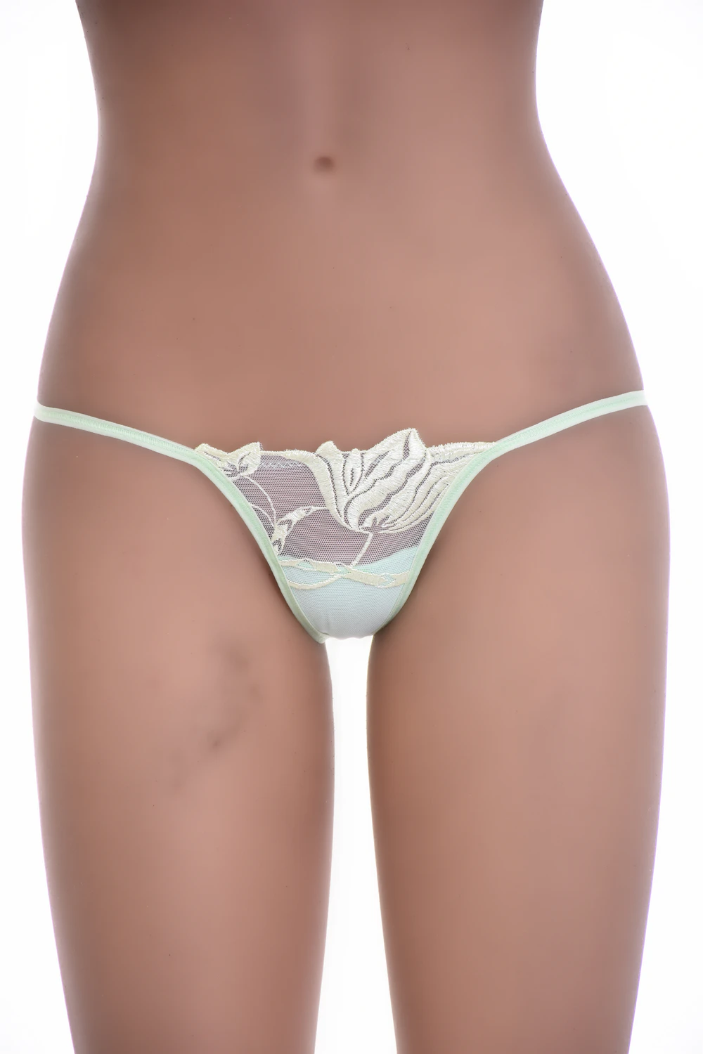 Light green floral lace G-string with scalloped edges and a slim string back, low-rise minimal coverage.