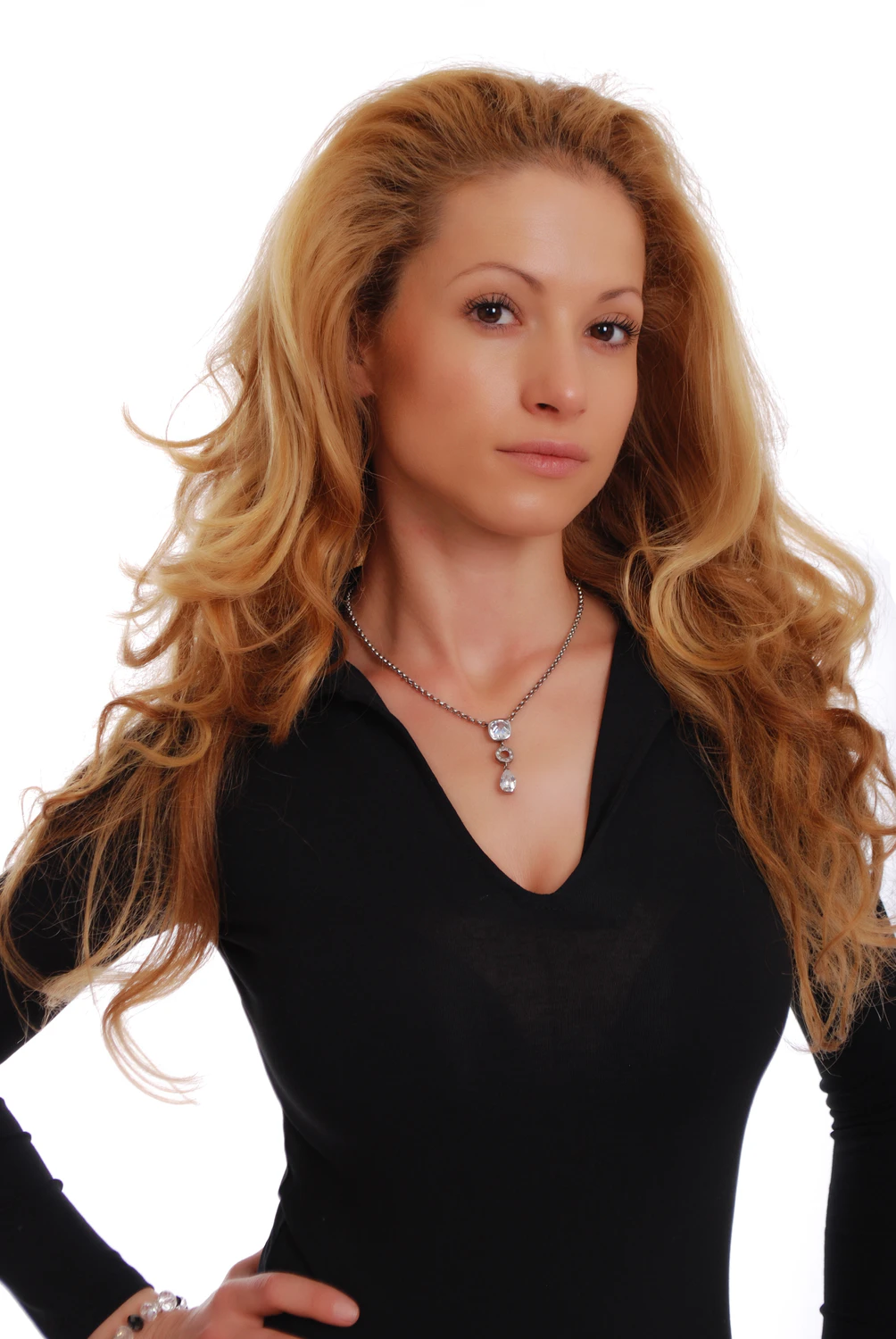 Long-sleeve cotton bodysuit with hook-and-eye gusset and thong bottom that holds a clean line.