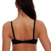 Molded-cup microfiber bra with a clean line under fitted clothing and a back hook-and-eye closure.