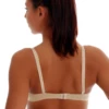 Molded microfiber T-shirt bra with a seam-free cup and steady band, smooth and invisible under close tops.